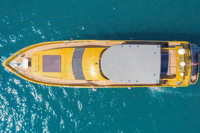  Yacht Photos Pics Aerial view of a 2007 Custom 85 Motor Yacht on clear blue water.