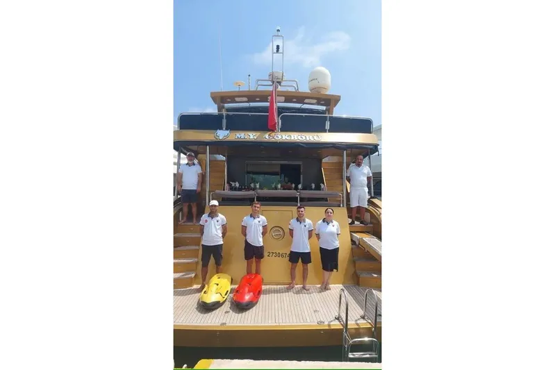  Yacht Photos Pics Crew standing on the deck of a 2007 Custom 85 Motor Yacht.