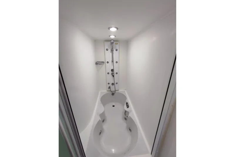  Yacht Photos Pics Luxurious bathroom with modern shower and tub on 2007 Custom 85 Motor Yacht.