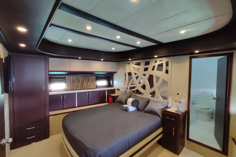  Yacht Photos Pics Luxurious bedroom interior of 2007 Custom 85 Motor Yacht with modern design and elegant decor.