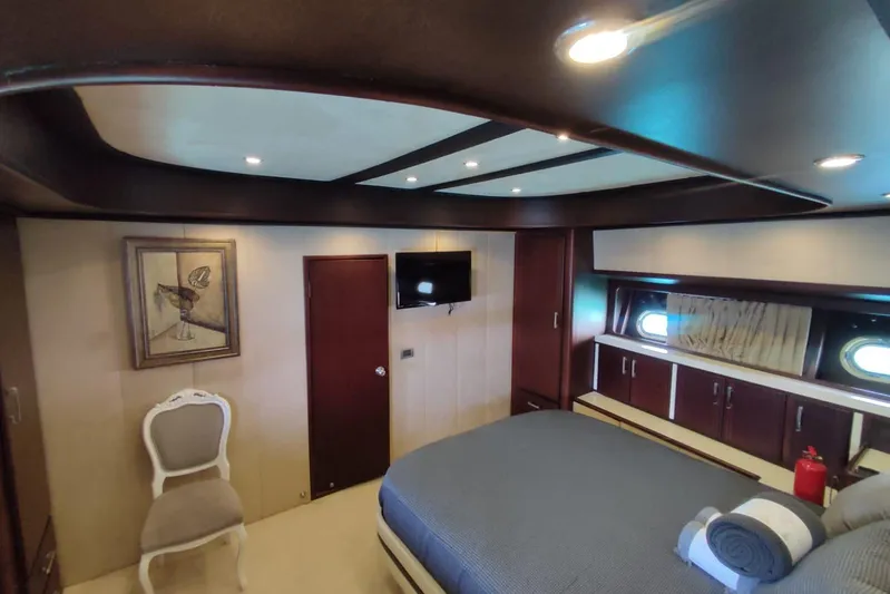  Yacht Photos Pics Luxurious bedroom interior of 2007 Custom 85 Motor Yacht with elegant furnishings and decor.