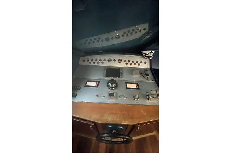  Yacht Photos Pics Control panel of a 2007 Custom 85 Motor Yacht, featuring navigation instruments and controls.