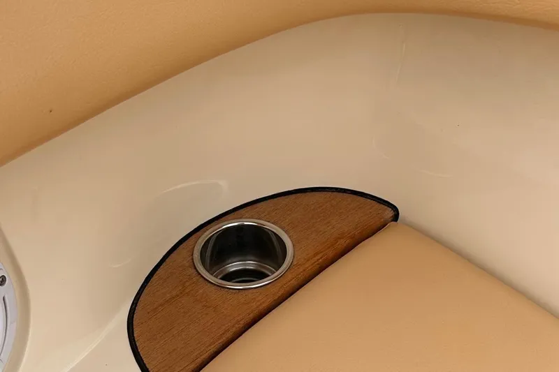  Yacht Photos Pics 2013 Chris-Craft Launch 28 interior detail with cup holder and beige upholstery.