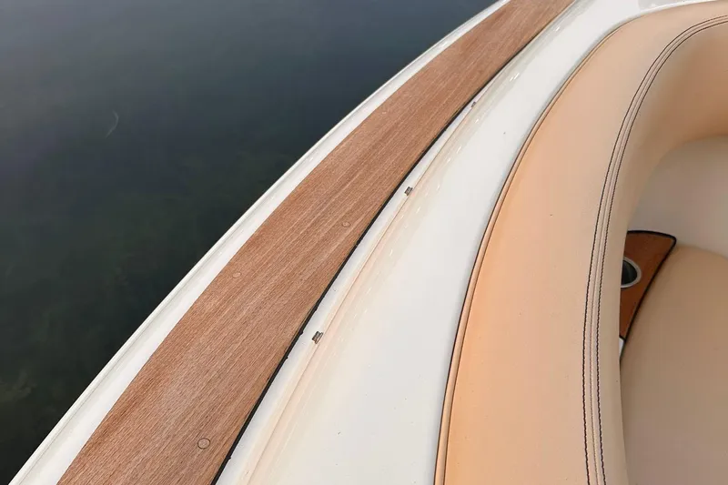  Yacht Photos Pics 2013 Chris-Craft Launch 28 boat with teak deck and beige seating detail.