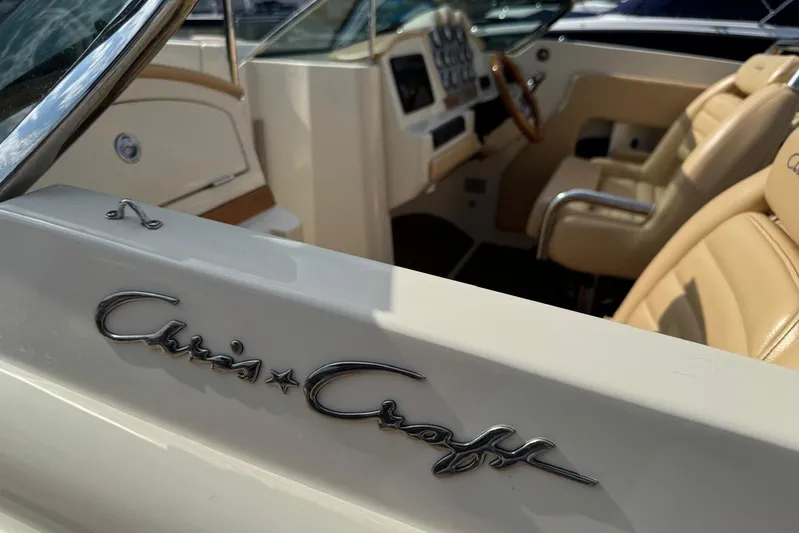  Yacht Photos Pics 2013 Chris-Craft Launch 28 boat interior with beige leather seats and dashboard.