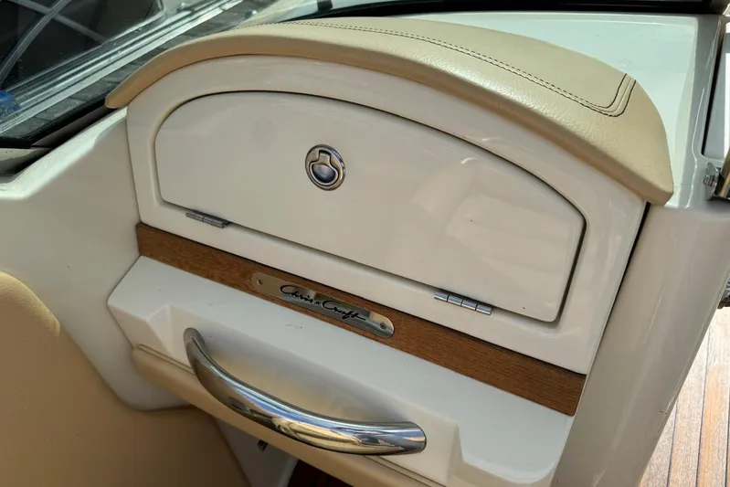  Yacht Photos Pics 2013 Chris-Craft Launch 28 interior detail with wood and chrome accents.