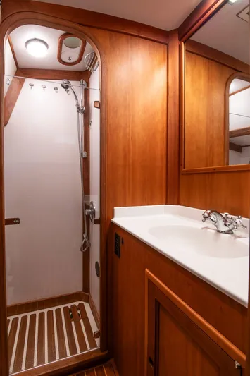 Regulus Yacht Photos Pics Hinckley Sou'wester 51 yacht bathroom, 1993 model, featuring wooden cabinetry and a shower.