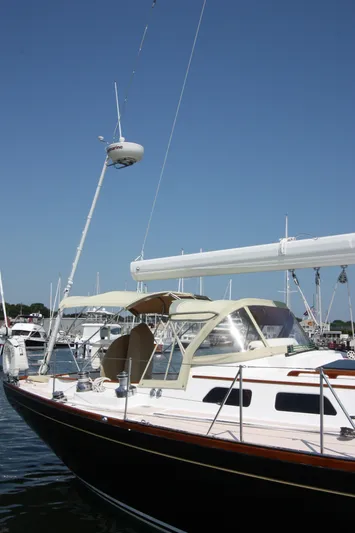 Regulus Yacht Photos Pics 1993 Hinckley Sou'wester 51 sailboat docked under clear blue sky.
