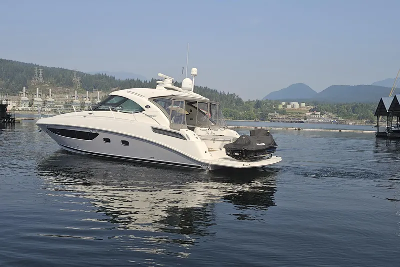 My Way Yacht Photos Pics 2013 Sea Ray 470 Sundancer yacht on calm water with scenic mountain backdrop.