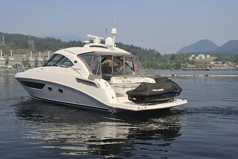 My Way Yacht Photos Pics 2013 Sea Ray 470 Sundancer yacht on calm water with scenic mountain backdrop.