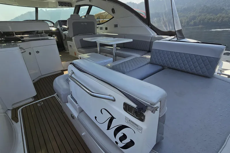 My Way Yacht Photos Pics Luxurious interior of 2013 Sea Ray 470 Sundancer yacht with elegant seating and dining area.