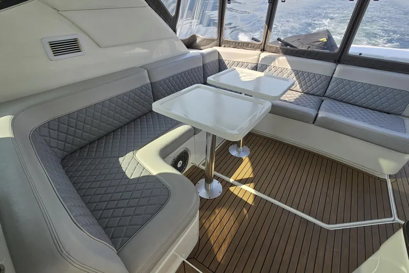 My Way Yacht Photos Pics Luxurious interior of 2013 Sea Ray 470 Sundancer with elegant seating and tables.