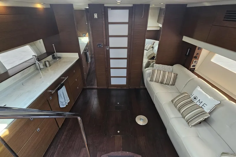 My Way Yacht Photos Pics Luxurious interior of 2013 Sea Ray 470 Sundancer yacht with modern kitchen and cozy seating area.