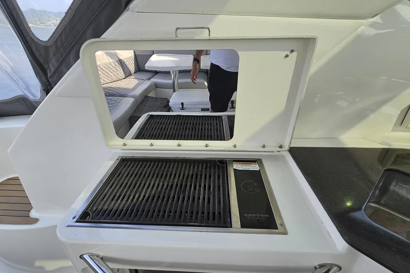 My Way Yacht Photos Pics Outdoor grill and seating area on 2013 Sea Ray 470 Sundancer yacht.