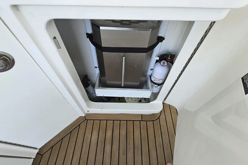 My Way Yacht Photos Pics 2013 Sea Ray 470 Sundancer interior compartment with fire extinguisher and equipment.