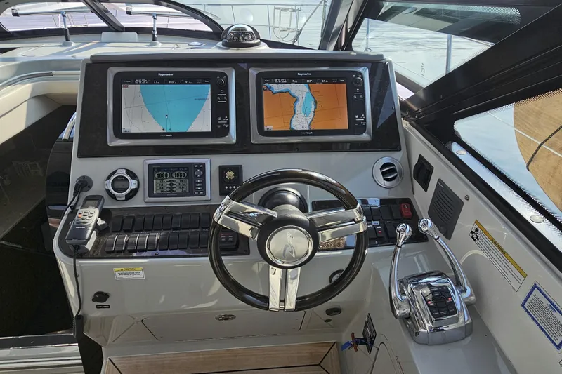 My Way Yacht Photos Pics Control panel of a 2013 Sea Ray 470 Sundancer yacht with navigation screens.