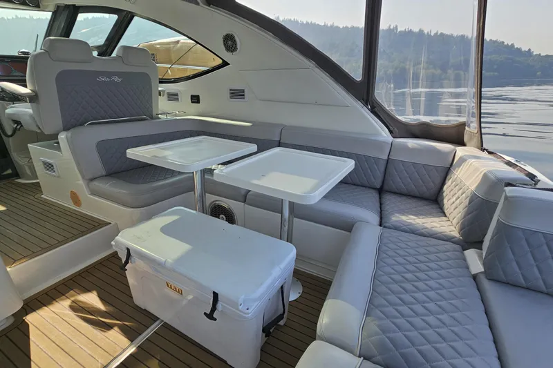 My Way Yacht Photos Pics Luxurious interior of 2013 Sea Ray 470 Sundancer yacht with plush seating and tables.