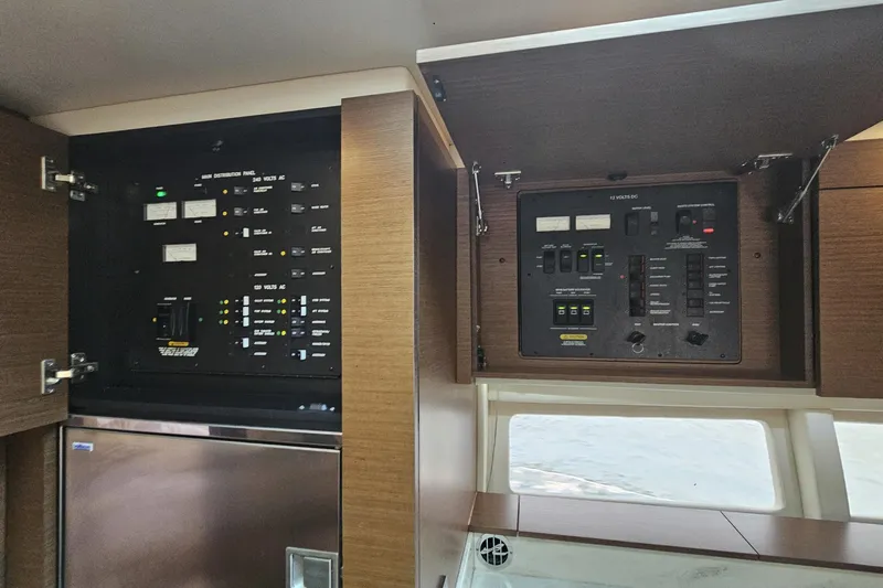 My Way Yacht Photos Pics Electrical control panels inside a 2013 Sea Ray 470 Sundancer yacht cabin.