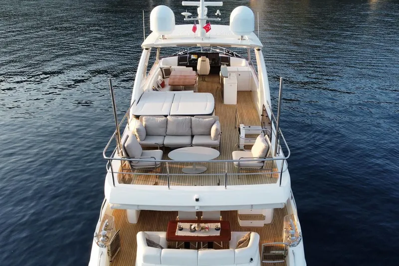 On Yacht Photos Pics Luxurious 2014 Princess 82 yacht with spacious deck and elegant seating on calm waters.