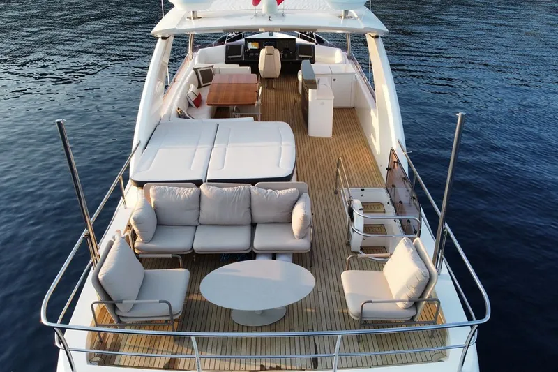 On Yacht Photos Pics Luxurious 2014 Princess 82 yacht with spacious deck and elegant seating on calm water.