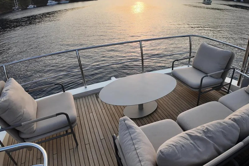 On Yacht Photos Pics Luxurious deck seating on 2014 Princess 82 yacht at sunset.