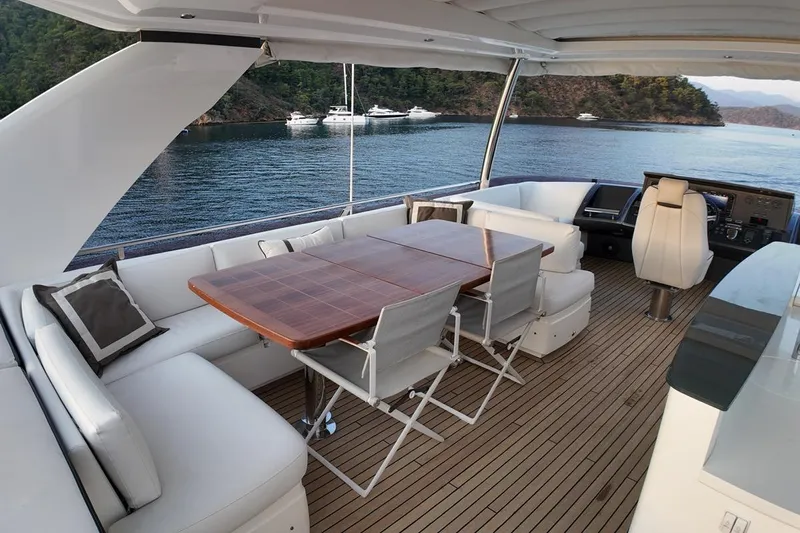 On Yacht Photos Pics Luxurious 2014 Princess 82 yacht interior with elegant seating and scenic ocean view.