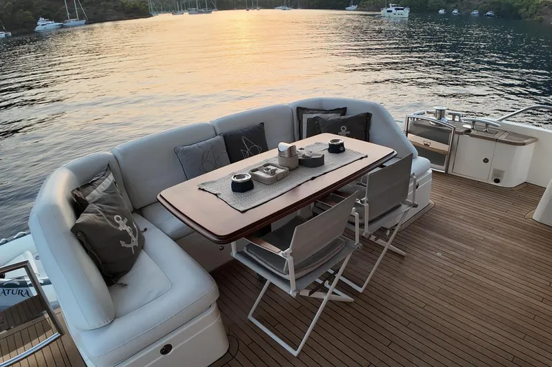 On Yacht Photos Pics Luxurious 2014 Princess 82 yacht deck with elegant seating and scenic water view.