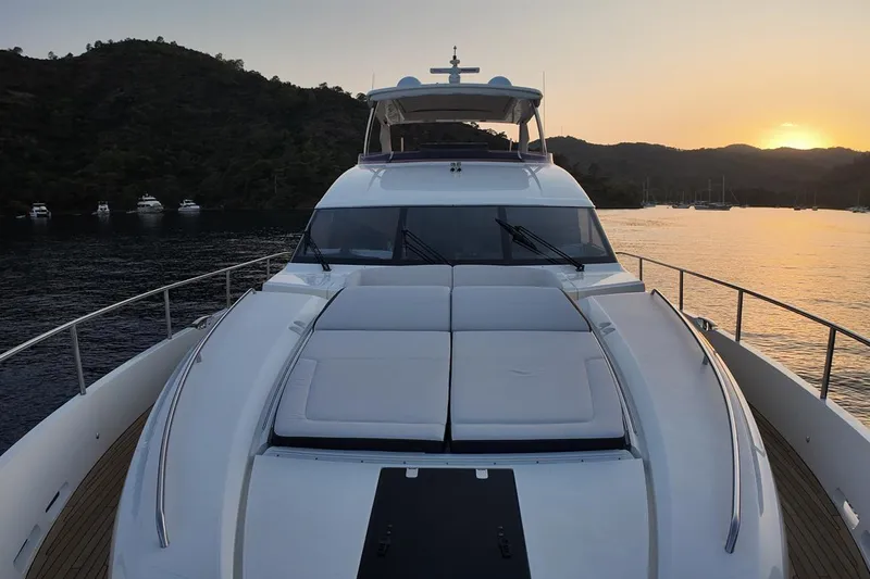 On Yacht Photos Pics Luxurious 2014 Princess 82 yacht at sunset, anchored near scenic coastline.