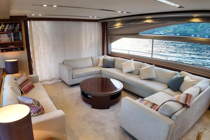 On Yacht Photos Pics Luxurious interior of a 2014 Princess 82 yacht with elegant seating and scenic water view.