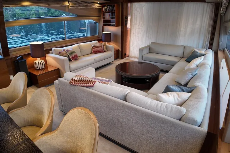 On Yacht Photos Pics Luxurious interior of 2014 Princess 82 yacht with elegant sofas and scenic window view.