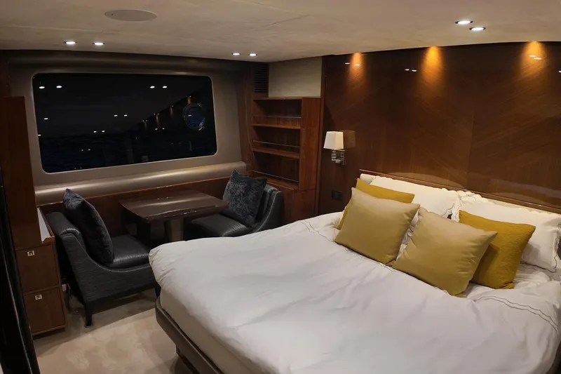 On Yacht Photos Pics Luxurious cabin interior of 2014 Princess 82 yacht with elegant bedding and seating area.