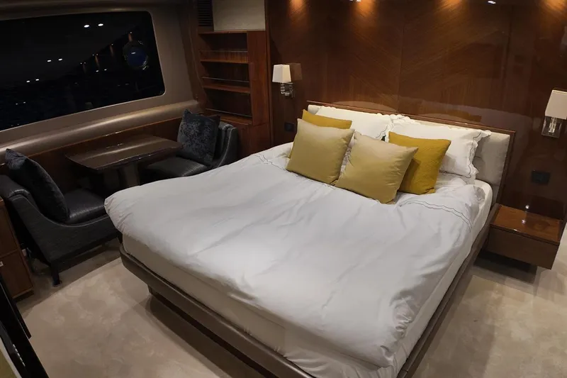 On Yacht Photos Pics Luxurious bedroom interior on 2014 Princess 82 yacht with elegant bedding and seating area.