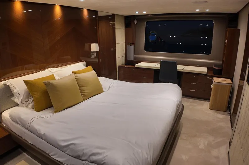 On Yacht Photos Pics Luxurious bedroom interior on a 2014 Princess 82 yacht with elegant furnishings.