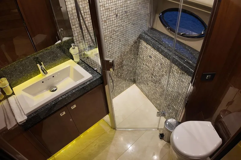 On Yacht Photos Pics Luxurious bathroom on 2014 Princess 82 yacht with modern sink and shower.
