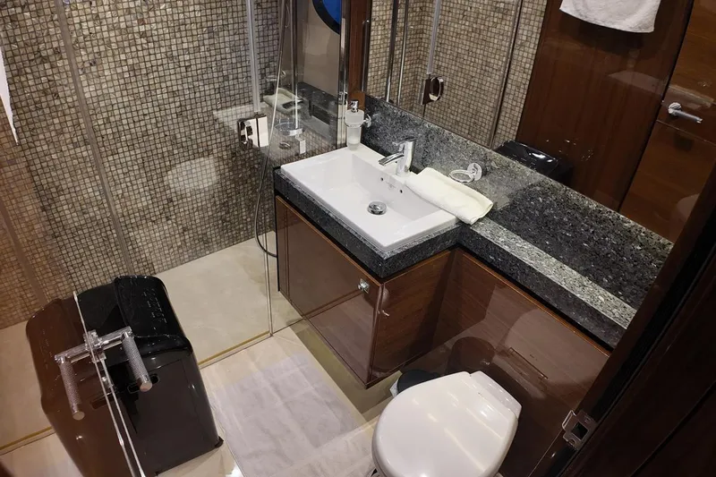 On Yacht Photos Pics Luxurious bathroom in 2014 Princess 82 yacht with modern fixtures and elegant design.