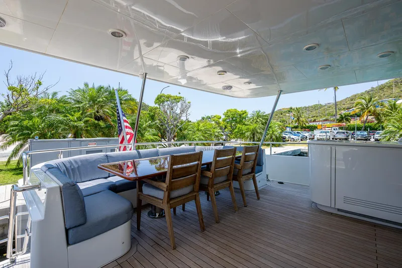 Lady Lorraine Yacht Photos Pics Spacious outdoor dining area on 2007 Cheoy Lee Bravo Flybridge Motor Yacht.