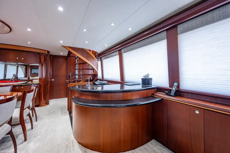 Lady Lorraine Yacht Photos Pics Luxurious interior of 2007 Cheoy Lee Bravo Flybridge Motor Yacht with elegant wood finishes.