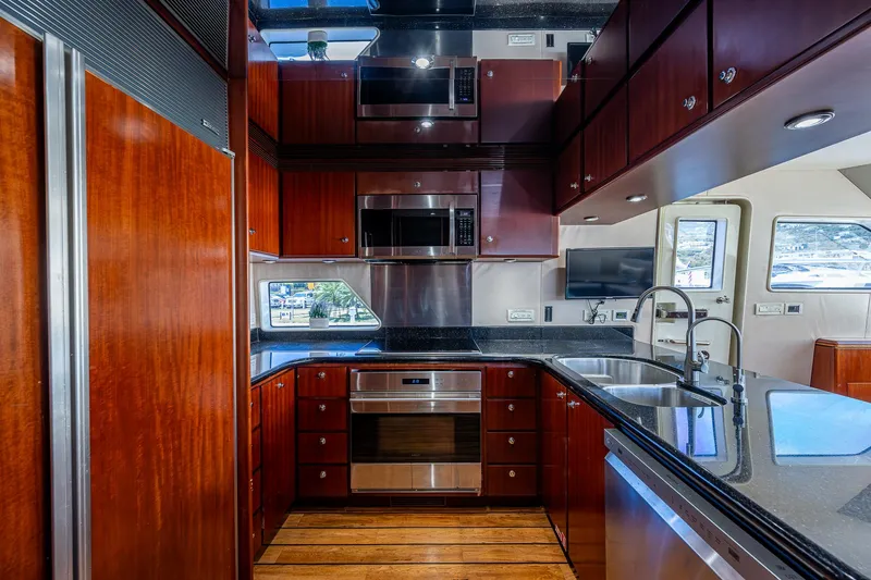 Lady Lorraine Yacht Photos Pics Luxurious kitchen in a 2007 Cheoy Lee Bravo Flybridge Motor Yacht with modern appliances.