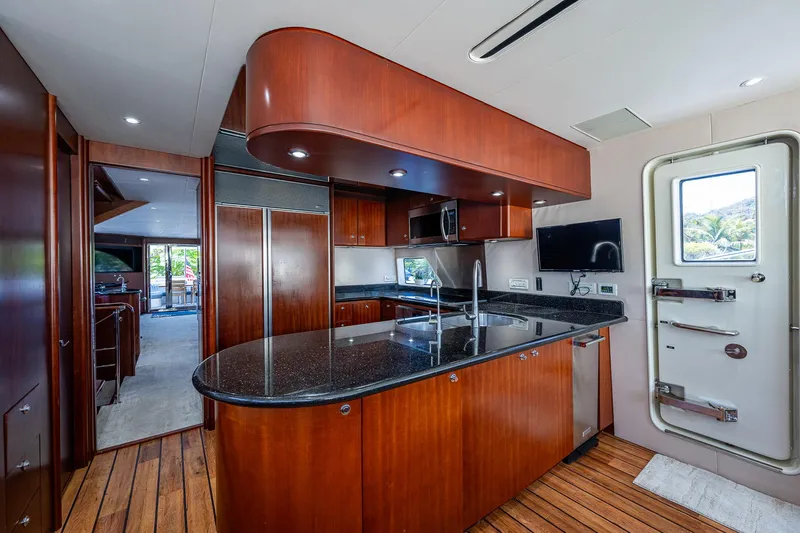 Lady Lorraine Yacht Photos Pics Luxurious kitchen interior of 2007 Cheoy Lee Bravo Flybridge Motor Yacht with modern amenities.