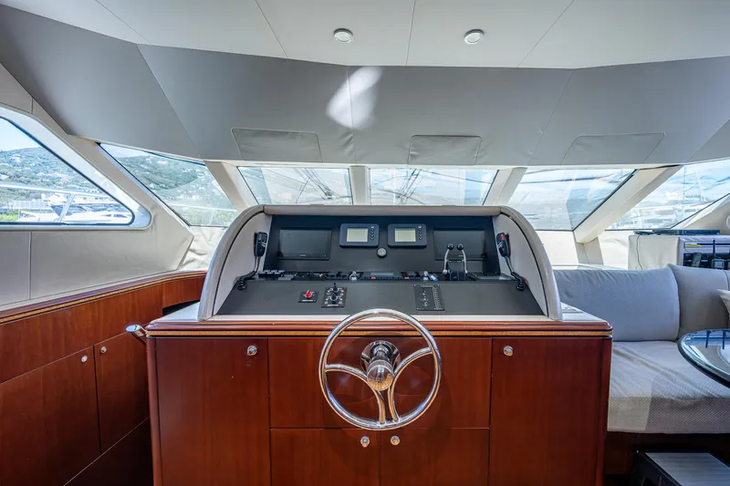 Lady Lorraine Yacht Photos Pics 2007 Cheoy Lee Bravo Flybridge Motor Yacht helm station with modern navigation equipment.
