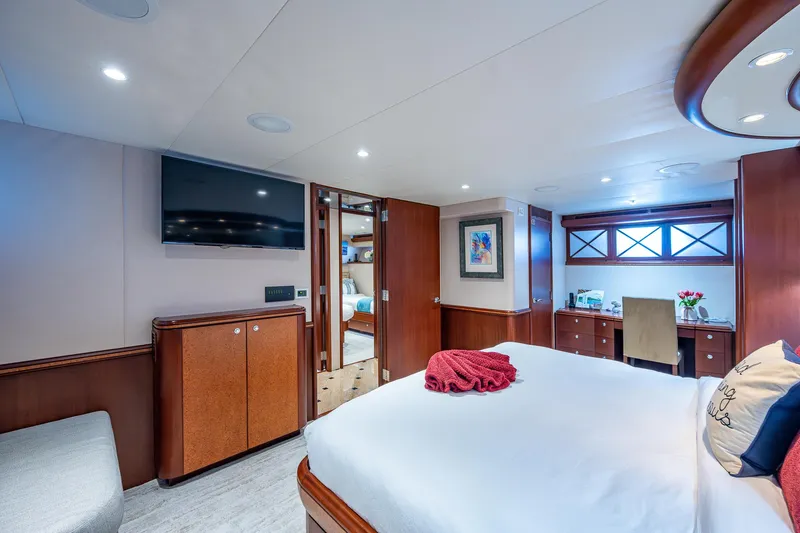 Lady Lorraine Yacht Photos Pics Luxurious bedroom interior of 2007 Cheoy Lee Bravo Flybridge Motor Yacht with modern amenities.