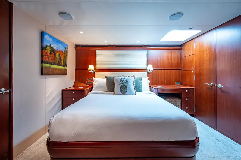 Lady Lorraine Yacht Photos Pics Luxurious bedroom in 2007 Cheoy Lee Bravo Flybridge Motor Yacht with wood paneling and skylight.