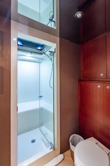 Lady Lorraine Yacht Photos Pics 2007 Cheoy Lee Bravo Flybridge Motor Yacht bathroom with shower and wooden cabinets.