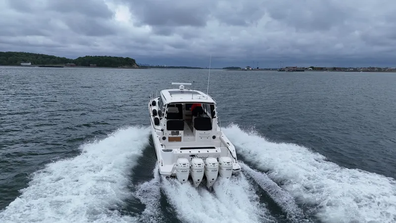  Yacht Photos Pics Boston Whaler 405 Conquest 2021 cruising on open water under cloudy skies.