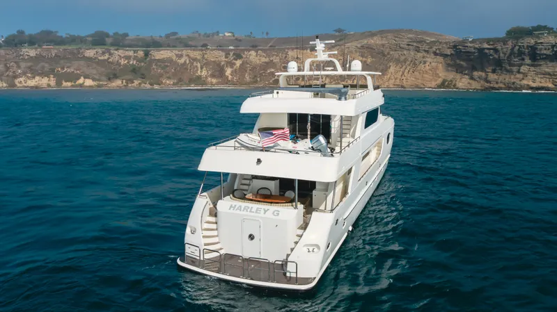 Harley G Yacht Photos Pics Luxury 2014 TransWorld 116' yacht cruising near scenic coastline.