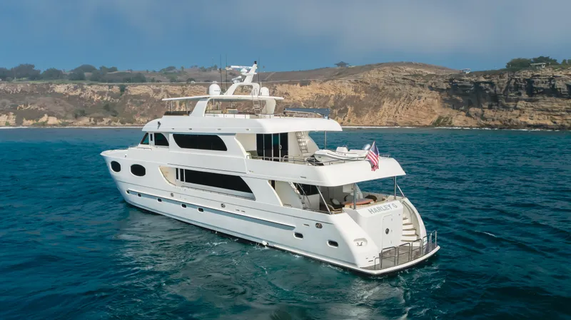 Harley G Yacht Photos Pics Luxurious 2014 TransWorld 116' yacht cruising near scenic coastal cliffs.
