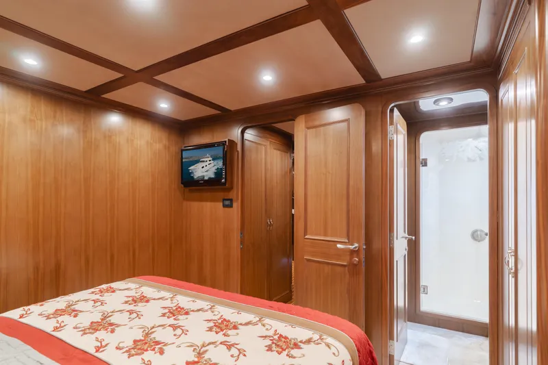 Harley G Yacht Photos Pics Luxurious wooden cabin interior on a 2014 TransWorld 116' yacht with elegant bedding.