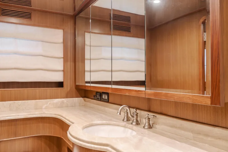Harley G Yacht Photos Pics Luxurious bathroom in 2014 TransWorld 116' yacht with elegant wood and marble finishes.