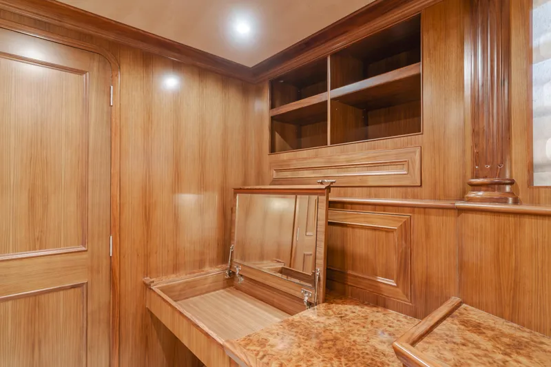 Harley G Yacht Photos Pics Luxurious wooden interior of 2014 TransWorld 116' yacht with elegant cabinetry and mirror.