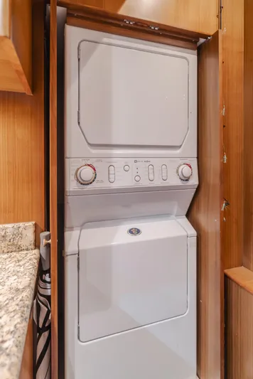Harley G Yacht Photos Pics Stacked washer and dryer in wooden cabinet, TransWorld 116', 2014 model.